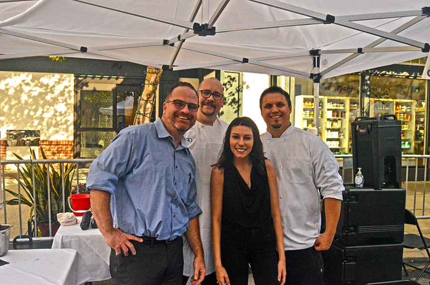 Three restaurant men and a woman posing at 2019 Mac and Cheese fest